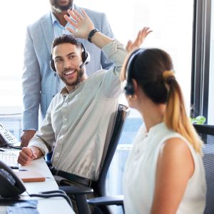 High five, success or happy man in call center for deal bonus, winning online or victory good news. Coworking, people or excited inbound agent consulting for telemarketing target and sales target